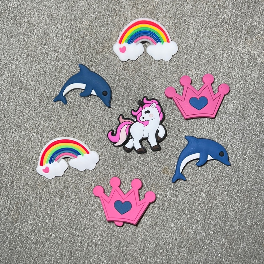 Croc charms. Rainbows 2, dolphins 2, crowns 2, unicorn 1. Brand new.